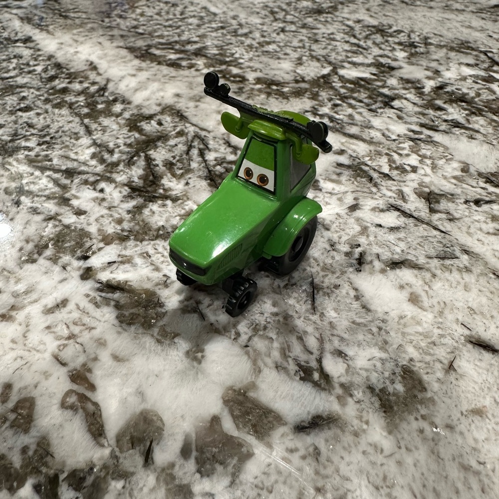 Vibrant Green Tractor Toy with Character Eyes